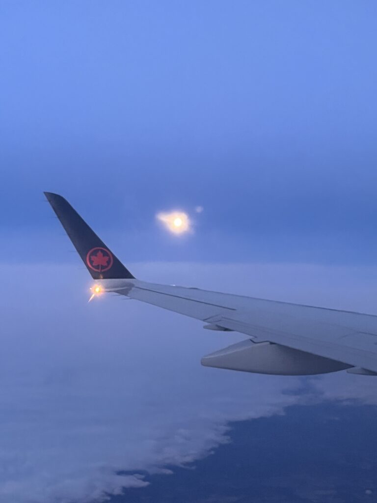 A view of the sky flying in Air Canada